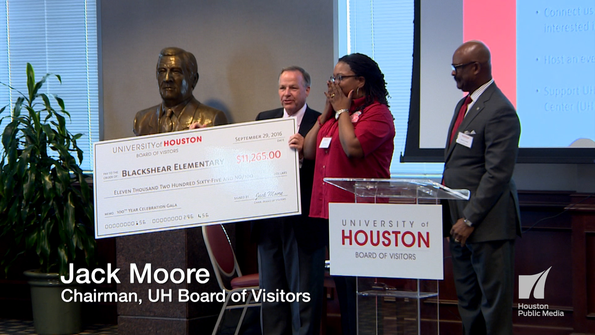 Jack Moore (BOV Pres.) and Wayne Luckett (Chair of the TASK FORCE) award a check to the Alicia Lewis, Principal of Blackshear Elementary school.