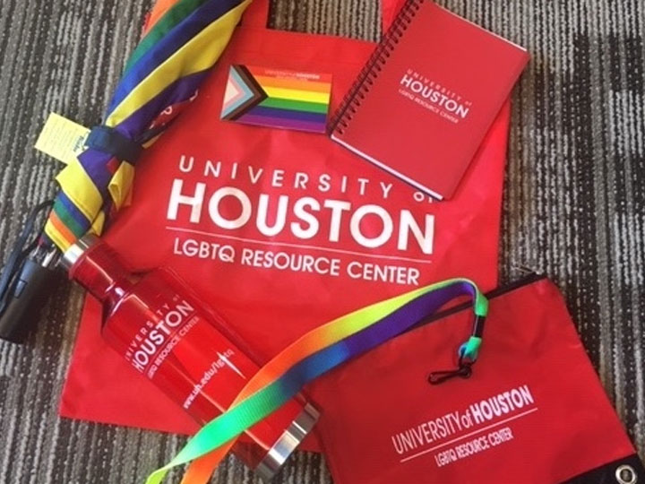 Red and rainbow swag - bag, lanyard, umbrella, sticker, bottle, pencil case.