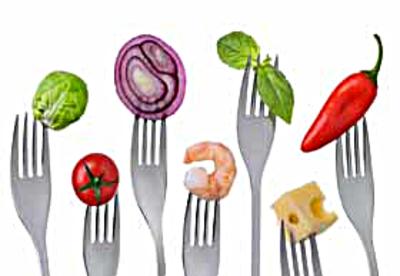 fresh healthy balanced food on forks isolated on a white background
