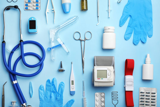 Assortment of medical instruments on a blue background