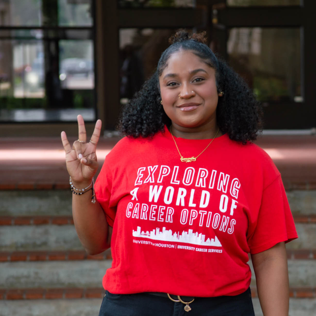 Student wearing red T-shirt that reads: Exploring a world of career options