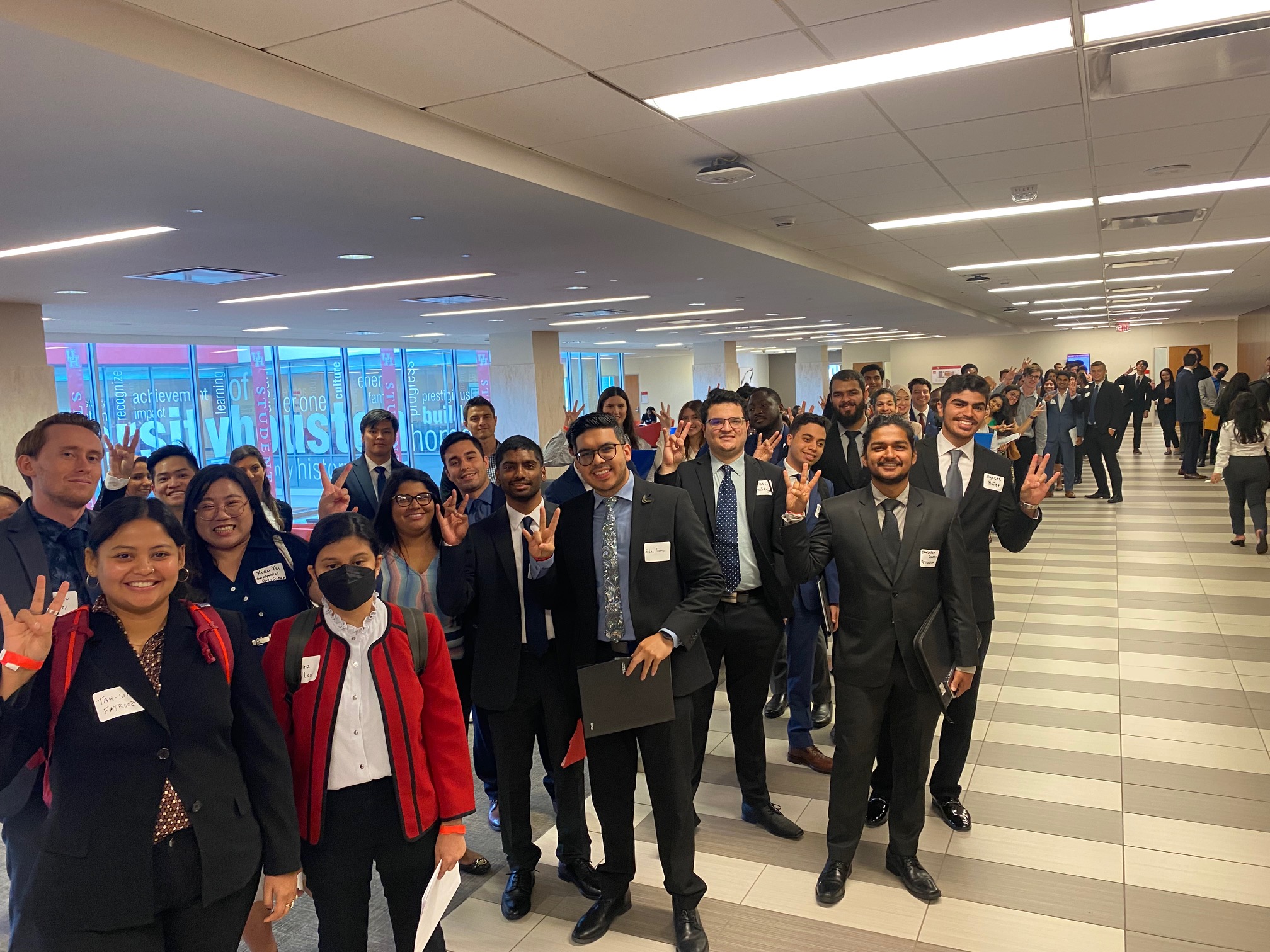 students dressed nicely in line waiting for career fair event to open doors