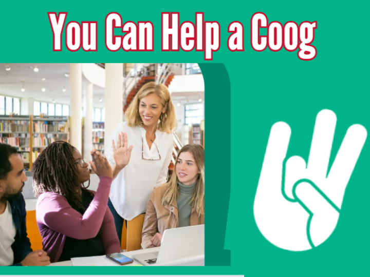 teacher high fiving a student sitting at a table with other students.