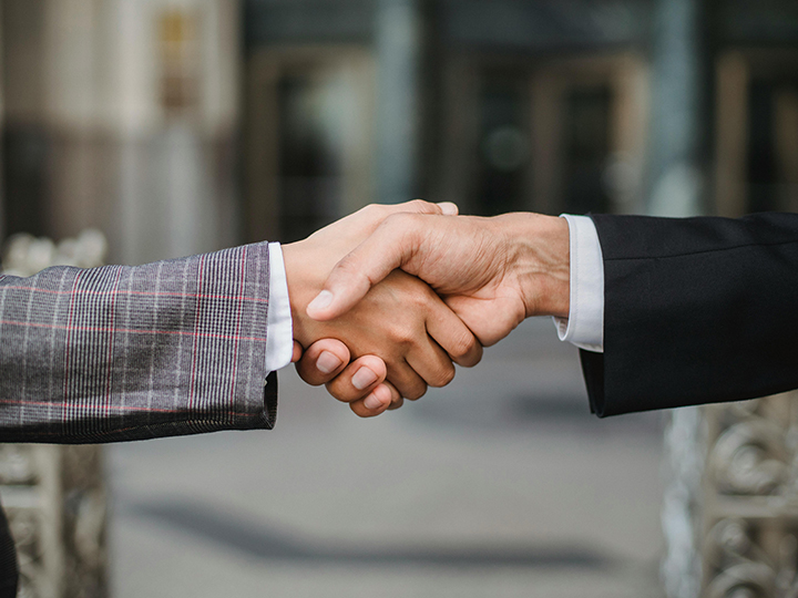 Two people shaking hands