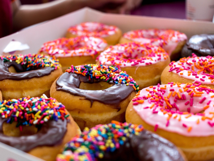 Chocolate and strawberry sprinkled donuts
