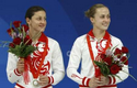 HHP alumnus Yulia Pakhalina (L) and current UH diver Anastasia Pozdnyakova of Russia pose with their silver medals after the women's synchronised 3m springboard diving final at the National Aquatics Center on August 10, 2008.