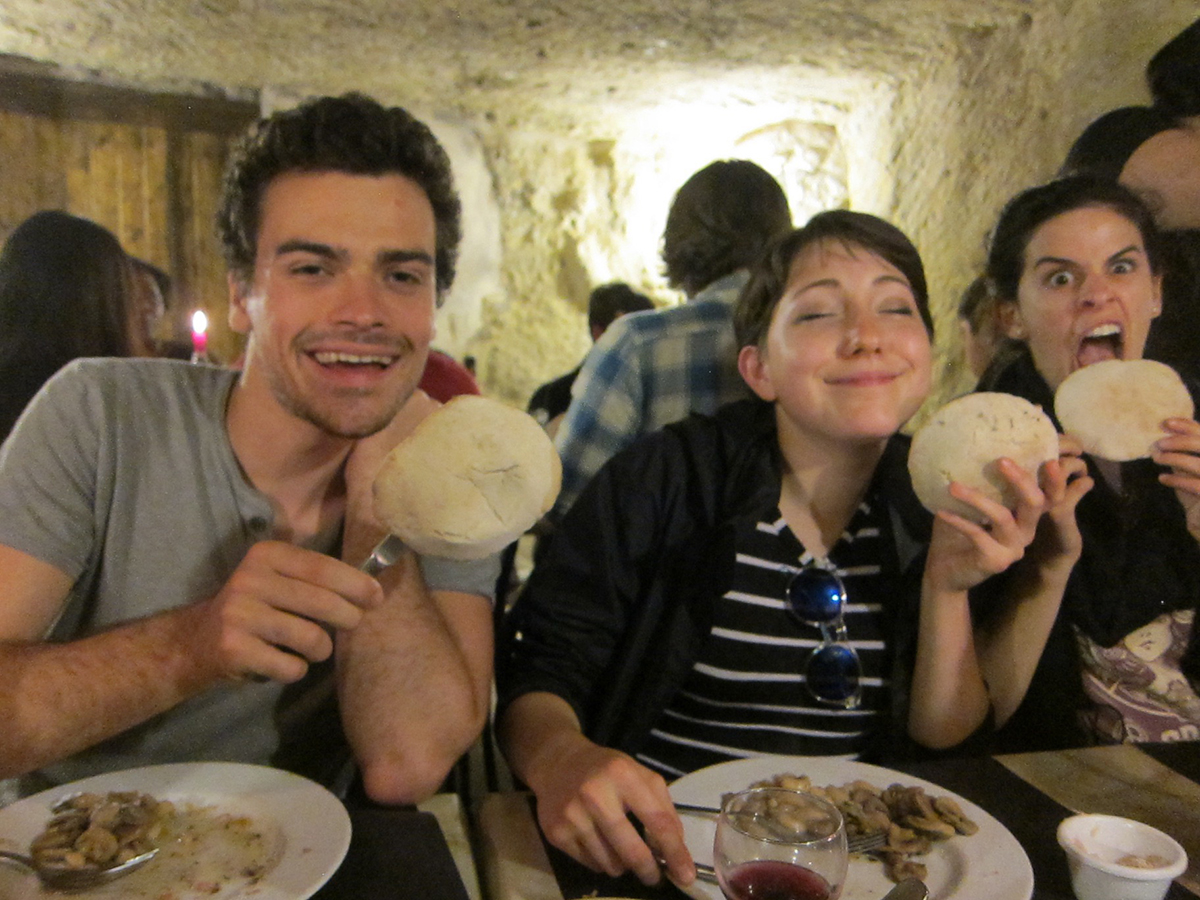 Eating little breads in a cave