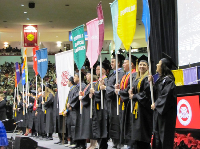 Fall 2012  Commencement Ceremony - banner bearers on stage