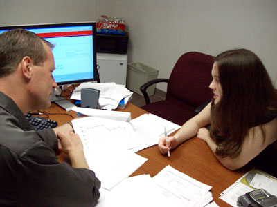 Dr. Peter Norton works with a graduate student on research.