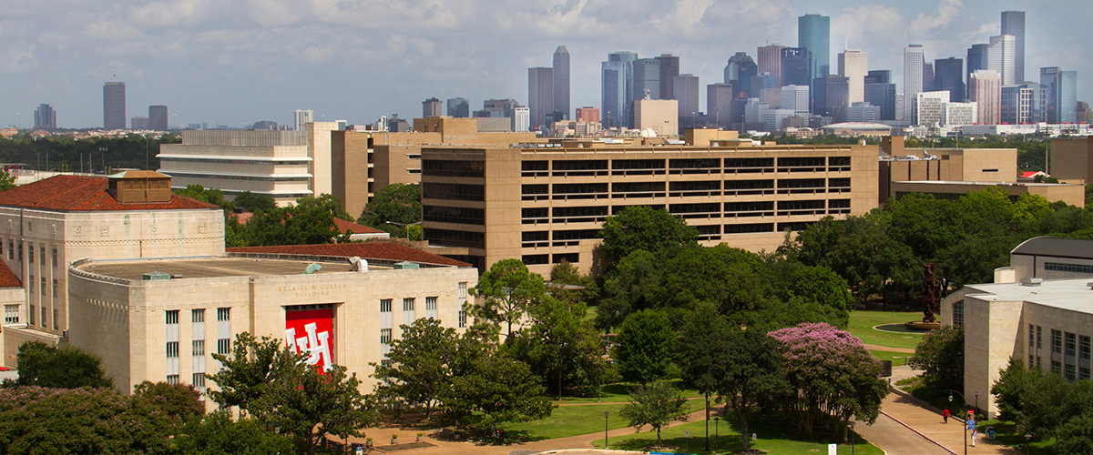 View of campus with downtown skyline in the background