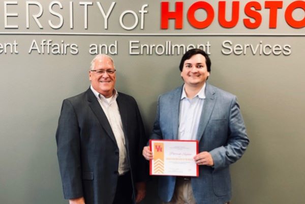Patrick Sajovec, UH Graduate Research Assistant in the College of Education Department of Psychological, Health, and Learning Sciences, (right), pictured with Vice President for Student Affairs and Enrollment Services Dr. Richard Walker