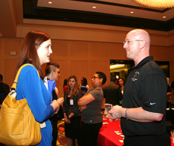 Student Teacher Candidate speaks with a recruiter at the HATC Job Fair.