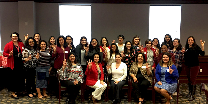 UH Regent Paula Mendoza (front row, second from left) was the keynote speaker at a Las Comadres event in December 2017.