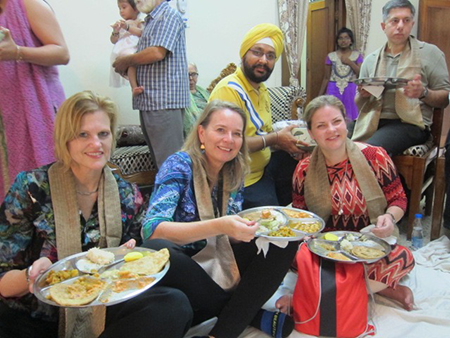 Laura Turchi (center) with and extended Sikh family of doctors and engineers enjoying a Diwali feasting.