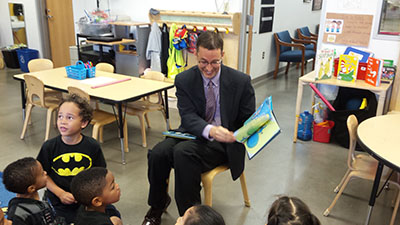 Jonathan Schwartz reads to UH Charter School children