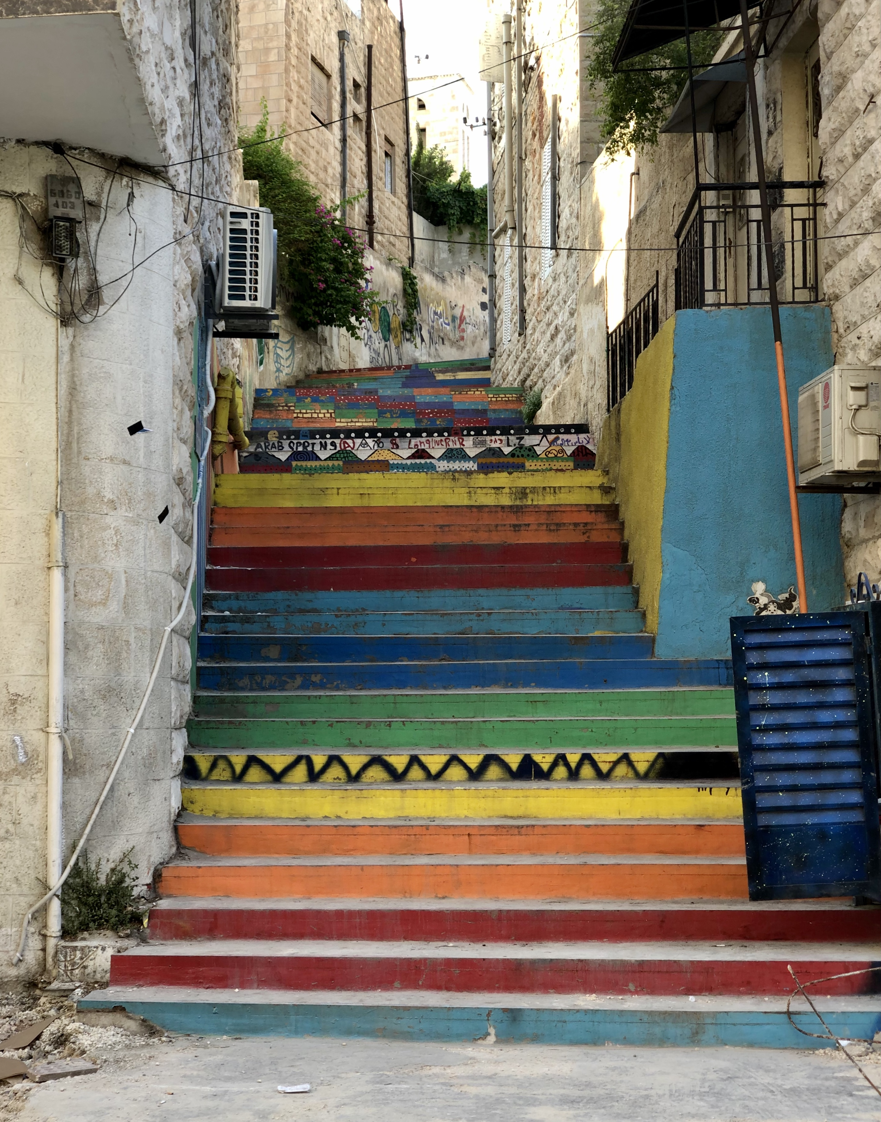 Rainbow-painted stairs connect downtown Amman to Rainbow Street
