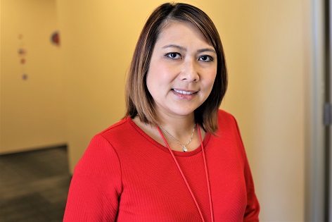 Portrait of dark brown-haired woman in a red top