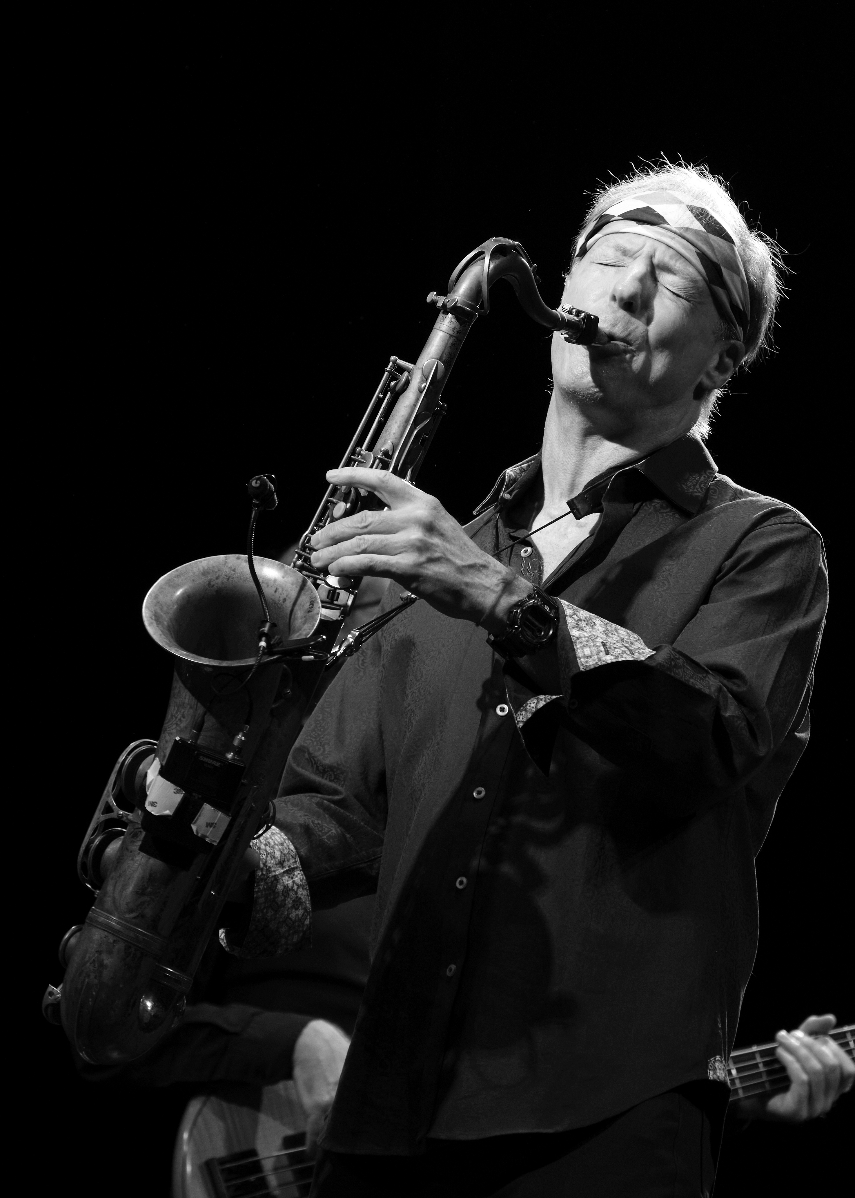 Black and white photo of Bill Evans playing the tenor saxophone