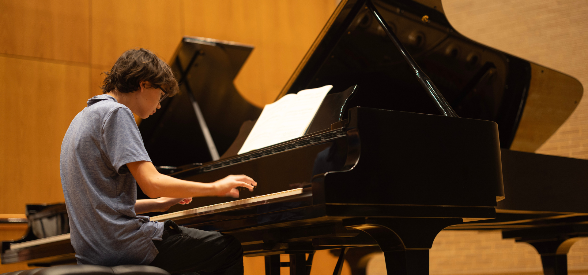 a young pianist playing a concerto