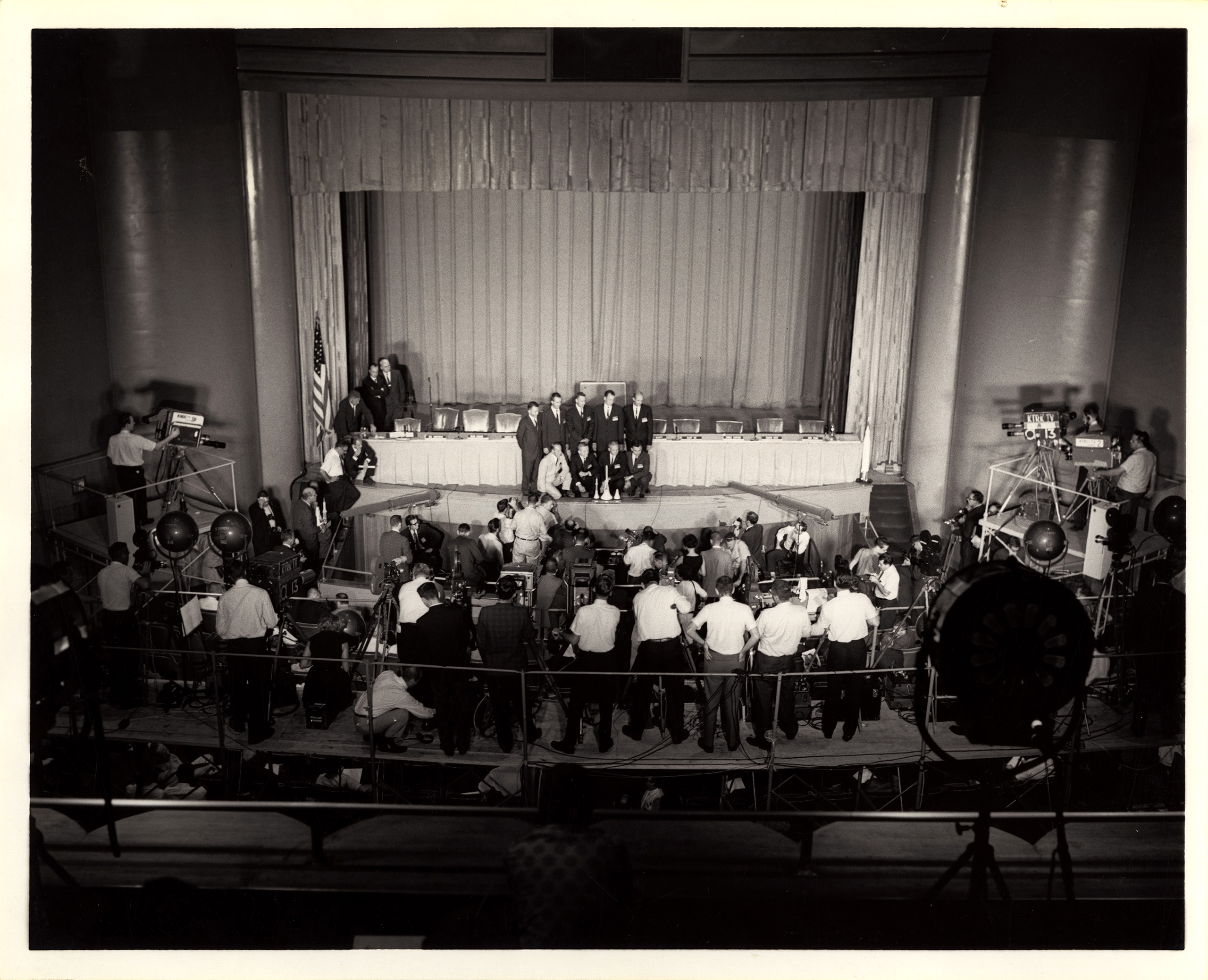 1960s astronauts "The Nifty Nine" onstage in Cullen Performance Hall.