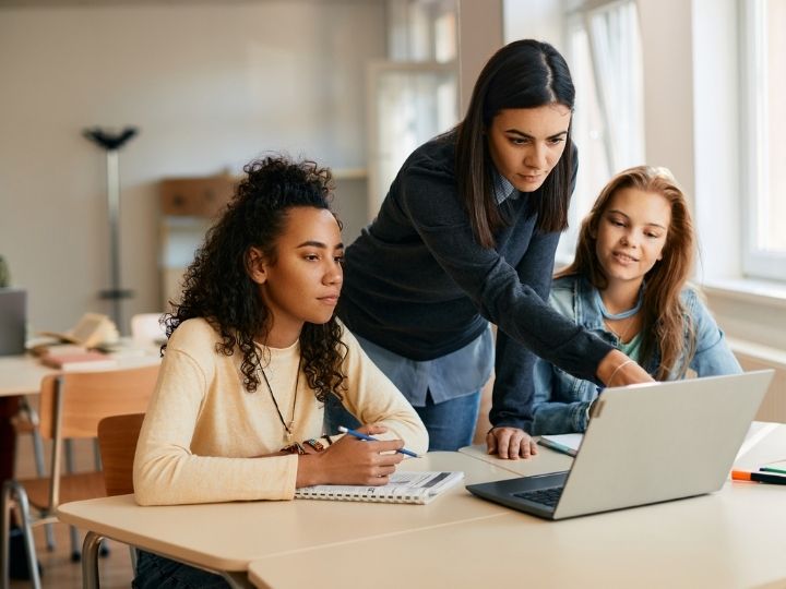 Photo of teacher and students in a classroom