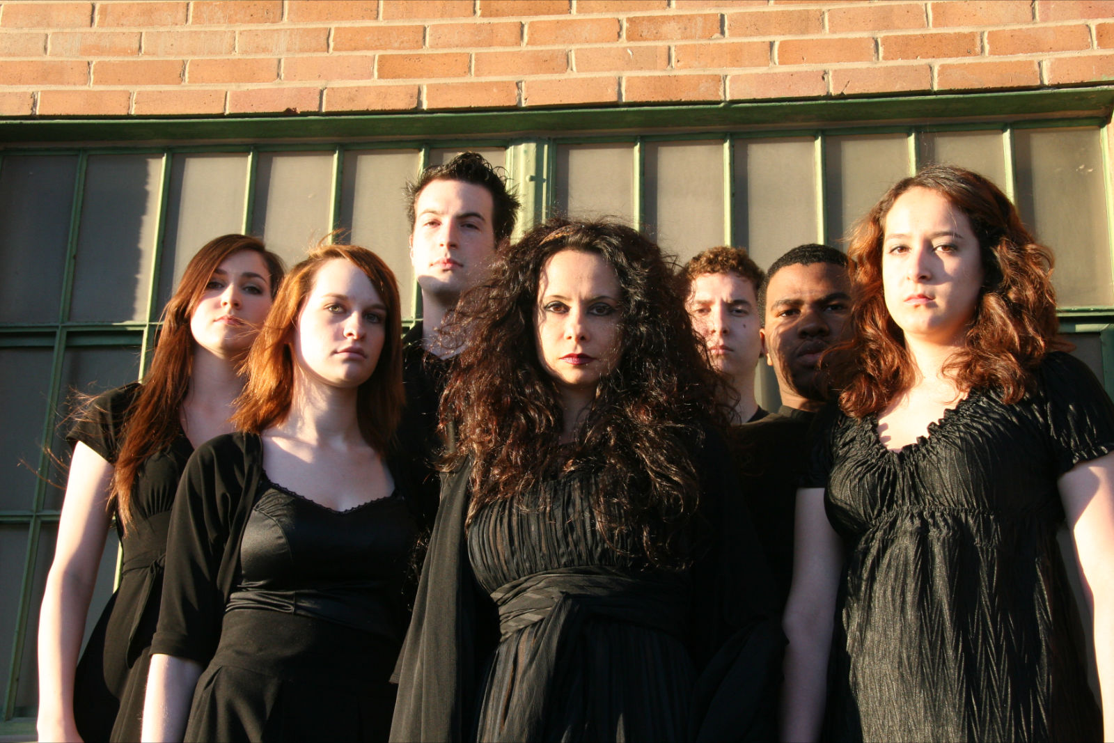 Misha Penton as Klynemestra, flanked by the chorus.