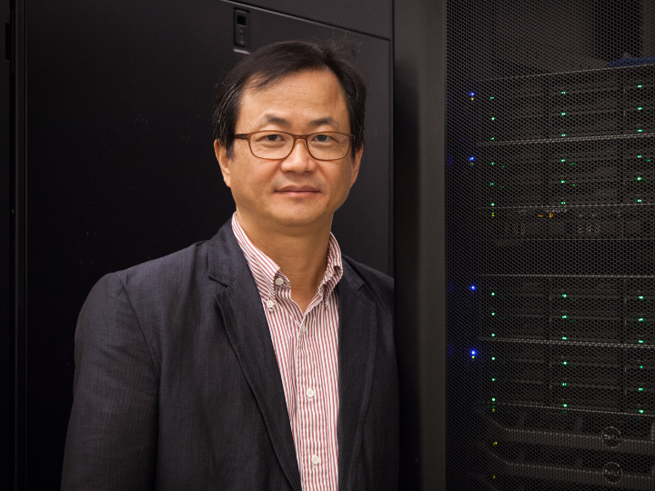 Yunsoo Choi standing in front of computers