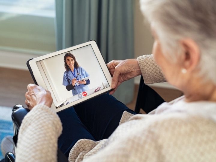 patient talking with doctor through telemedicine 