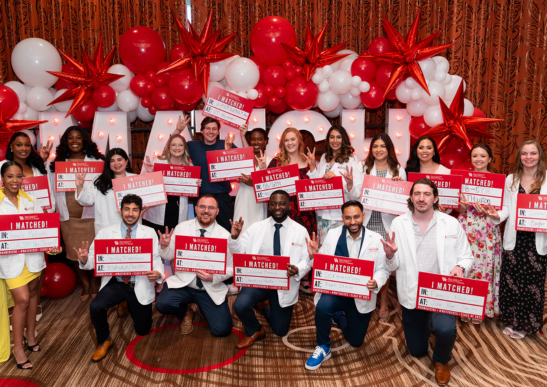 UH medical students with their ''I Matched'' signs 
