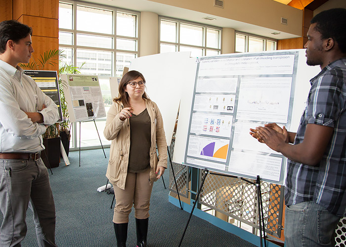 UH undergraduates Uchechukuru Akoma and Lily Ortega present their research findings at the STEGG Conference.