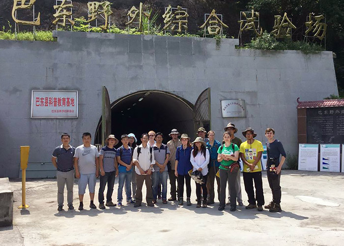The landslide surveying team poses in front of the tunnel crossing the Huangtupo landslide.