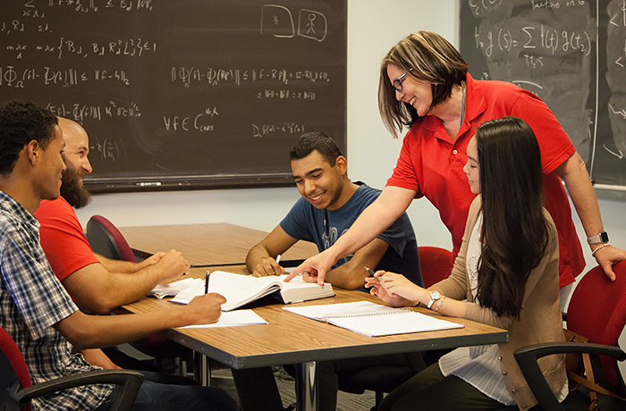 George leading a Calculus study session. (Photo credit, Chris Watts, NSM)