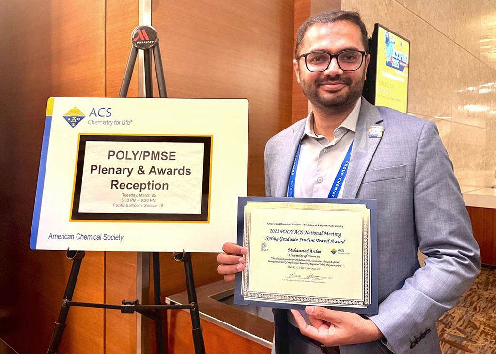 Muhammad Arslan with his award at POLY/PMSE Plenary & Awards Reception in San Diego, CA.