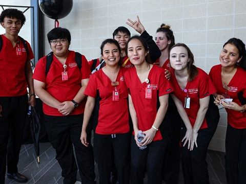 Traditional BSN nursing students in red scrubs