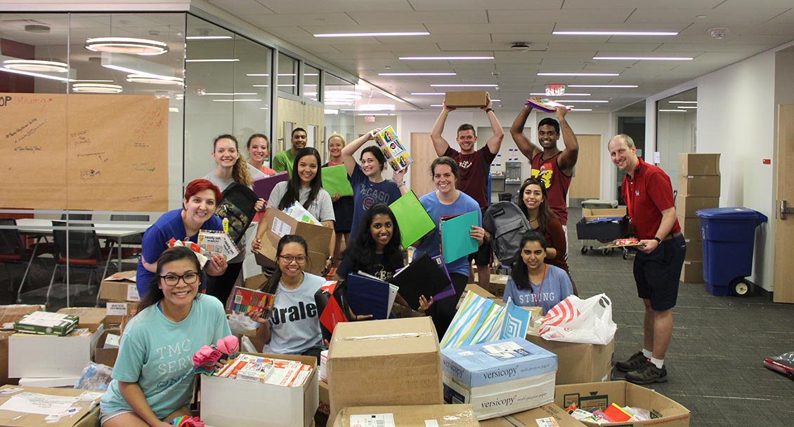uhcop students packing donations