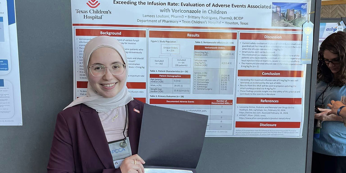 Loubani at poster with Honorable Mention award