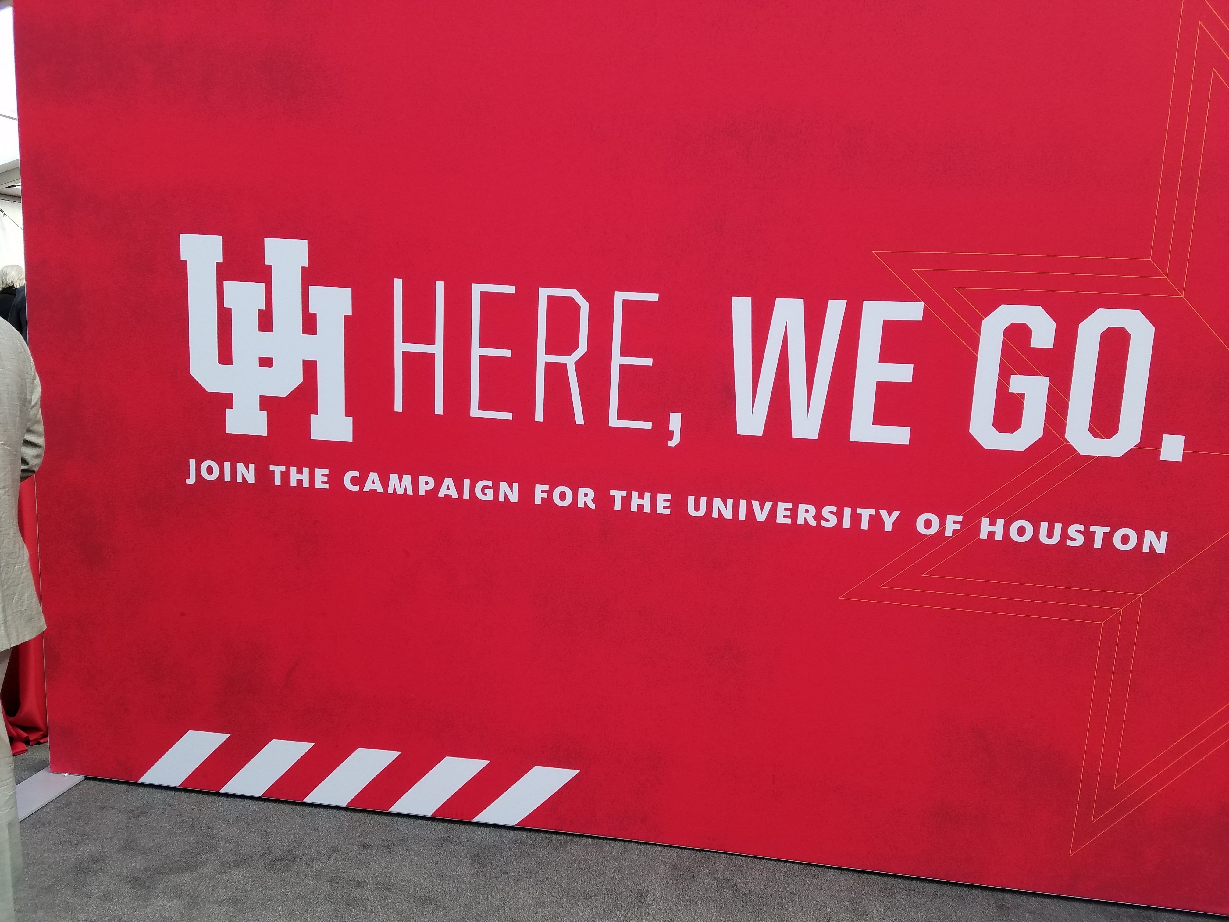 Red Banner that says UH Here We Go