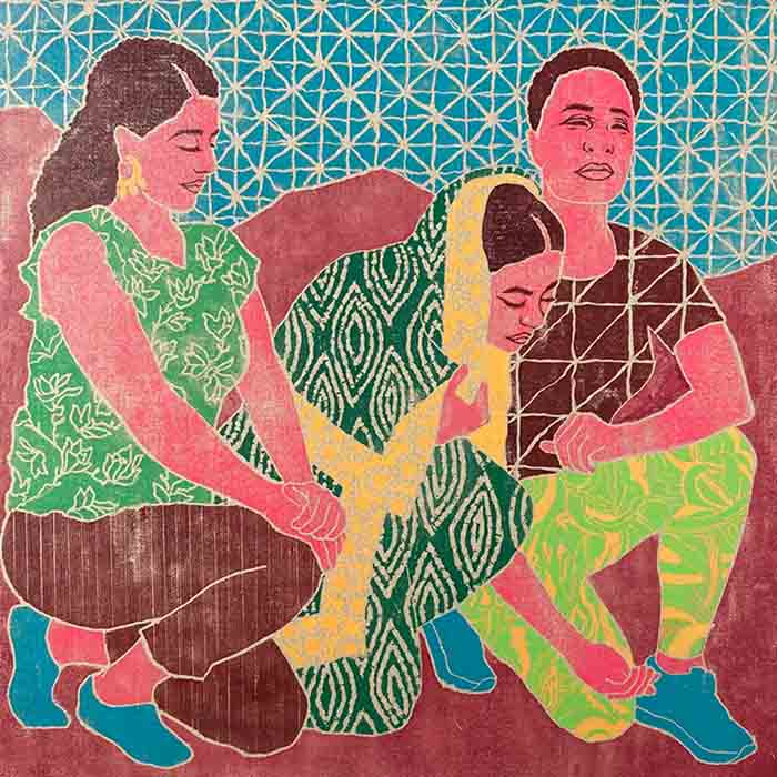 Block print art of three women kneeling together on the ground.