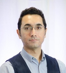 Portrait of dark-haired man wearing glasses