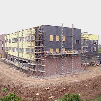 A building under construction with scafolding surrounding it