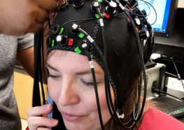 Image of Stacey Gorniak using the neuroimaging device.