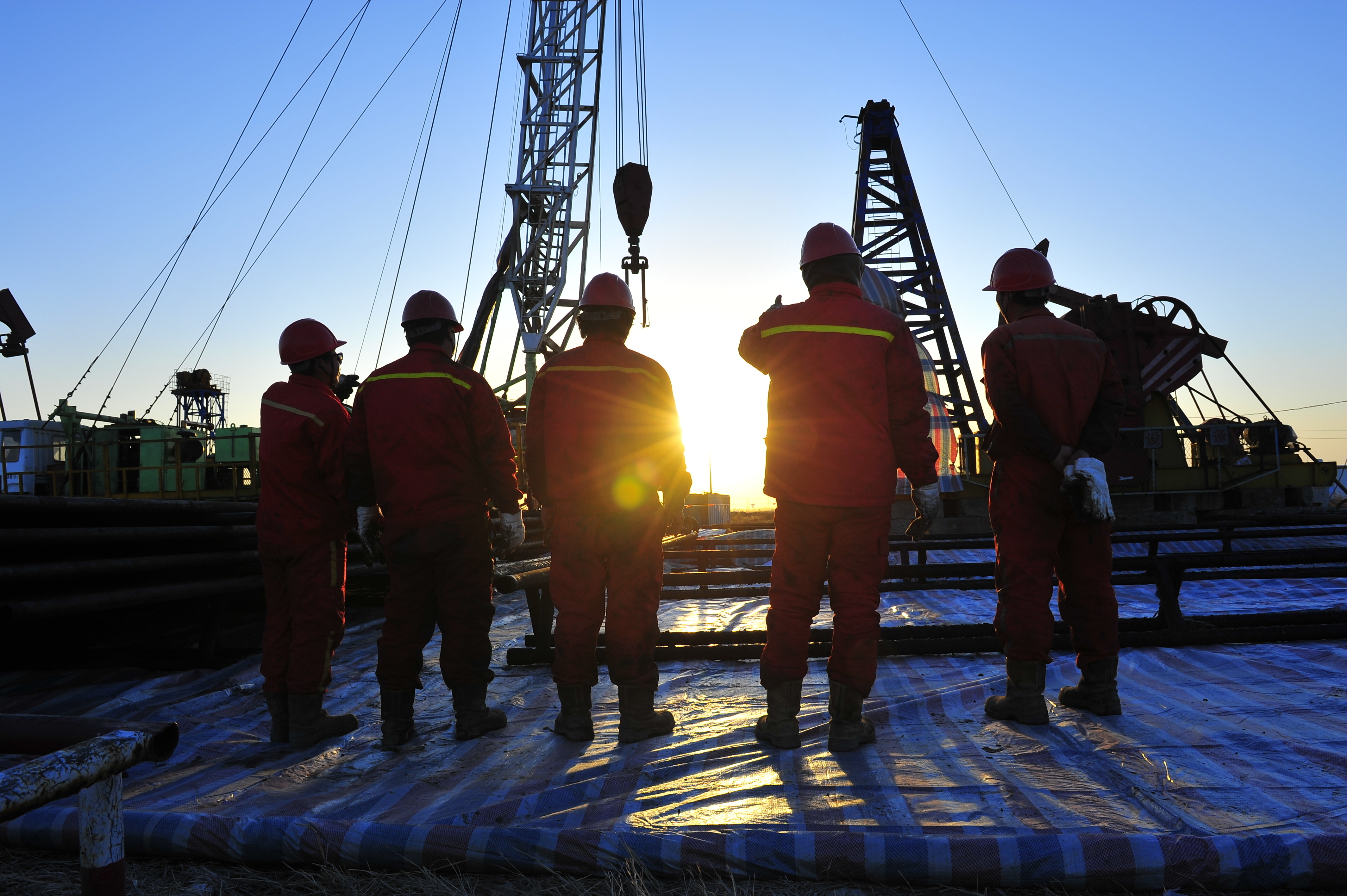 Offshore Workers At Sunset Image
