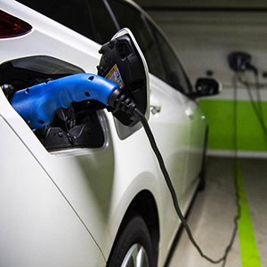Closeup view of an electric vehicle being charged